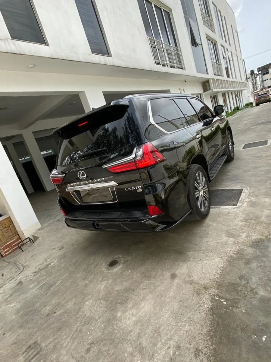 Black Lexus LX 570 Super Sport for hire in Lagos, rear three-quarter view